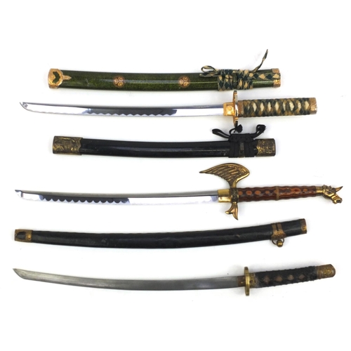 667 - Three decorative Samurai swords, the longest 81cm long