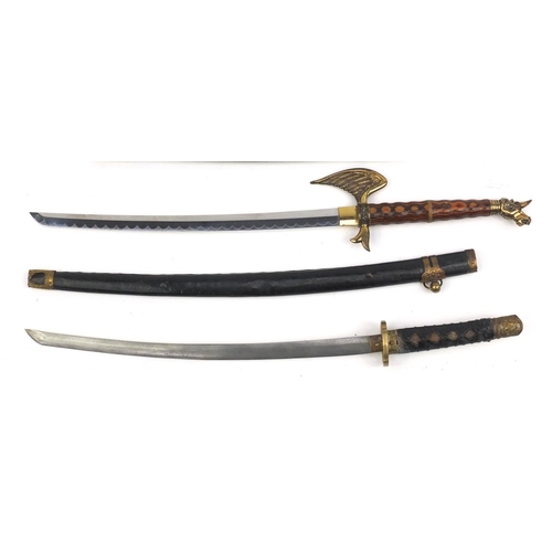 667 - Three decorative Samurai swords, the longest 81cm long