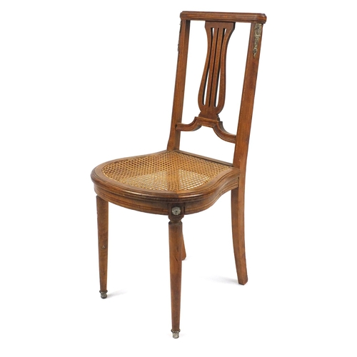 51 - Inlaid occasional chair with brass mounts and cane seat, 90cm high