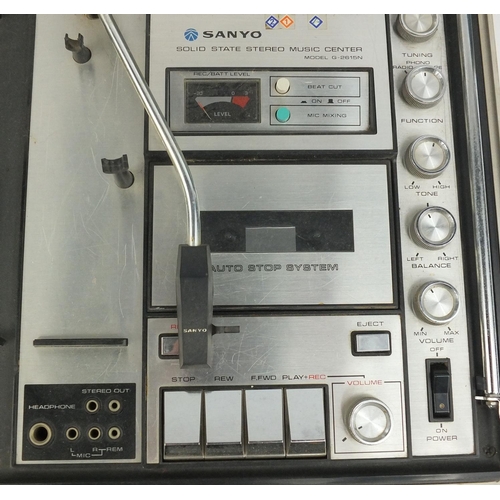 240 - Sanyo portable record player, tape cassette and radio