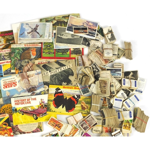 637 - Extensive selection of assorted cigarette and tea cards, some arranged in albums