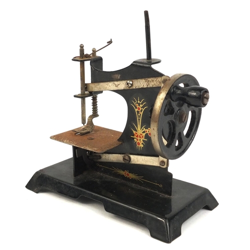 412 - Miniature black enamelled sewing machine, 16cm high