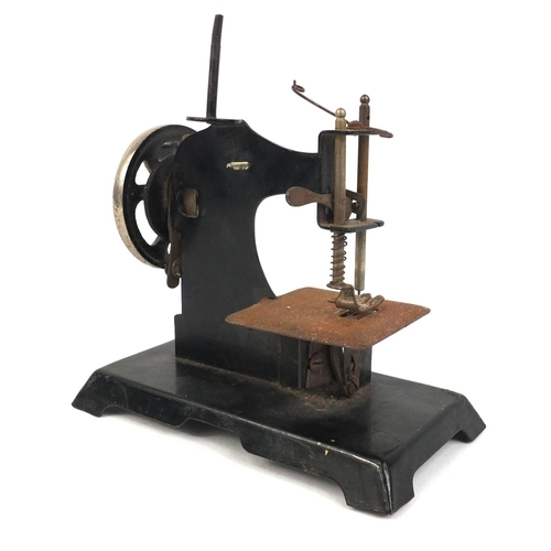 412 - Miniature black enamelled sewing machine, 16cm high