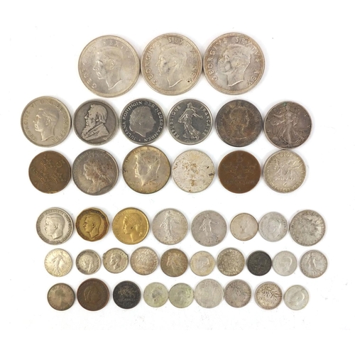 392 - Assorted World coins including silver examples, South African five cent pieces etc