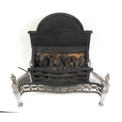 101 - Adams style cast iron coal effect fire and a companion set with firedogs, the fire 80cm long