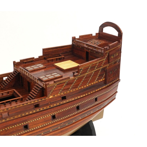 83 - Large hand built wooden galleon on stand, approximately 130cm long