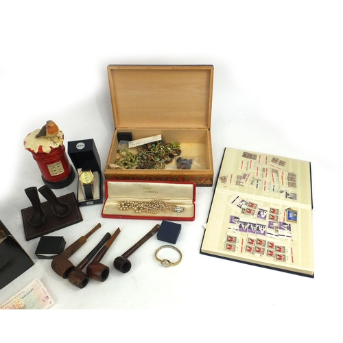 396 - Box of items to include a large quantity of copper coins, costume jewellery, stamps, pipes etc