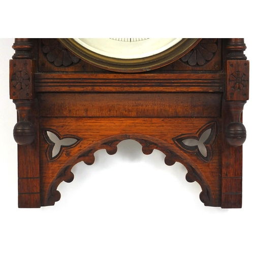 91 - Edwardian carved oak framed barometer, the dial approximately 23cm diameter