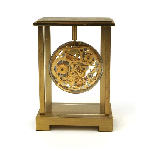 2089 - Brass cased mystery alarm mantel clock with key, 11.5cm high