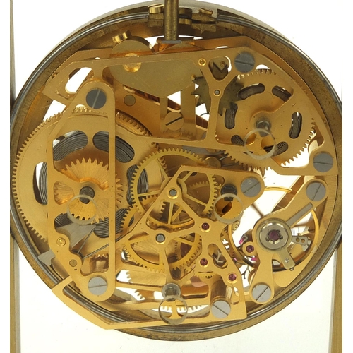 2089 - Brass cased mystery alarm mantel clock with key, 11.5cm high