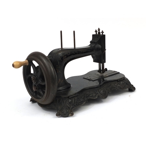 45 - Victorian cast iron mechanical sewing machine, numbered 285154 108154, 21cm high x 42cm in length