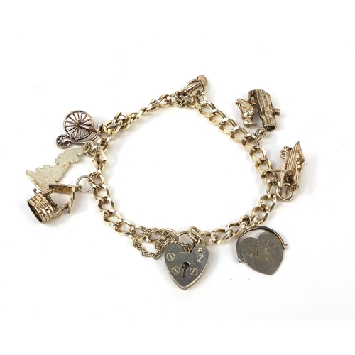 354 - Silver charm bracelet with a selection of charms including 'I Love You' spinner, approximate weight ... 