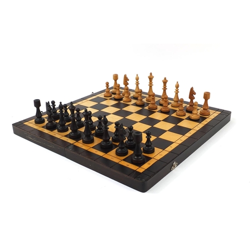 434 - *WITHDRAWN*Carved wooden chess set and board, the board 47cm square