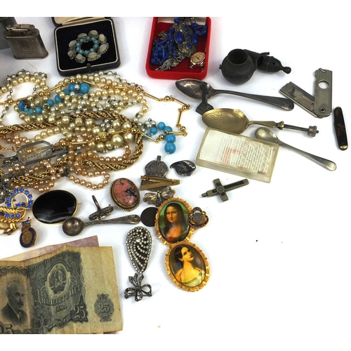 380 - Two bags of objects including coins, bank notes, costume jewellery, lighters, silver ARP brooch