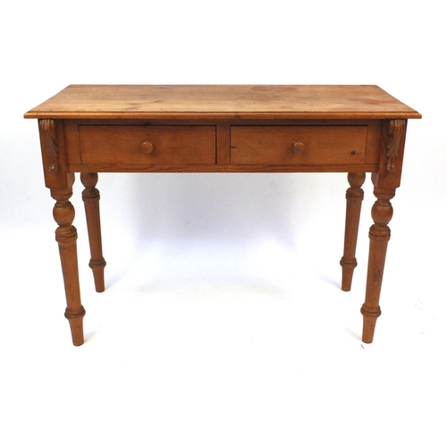 61 - Pine two drawer side table, 77cm high x 106cm wide x 45cm deep