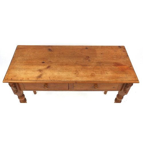 61 - Pine two drawer side table, 77cm high x 106cm wide x 45cm deep