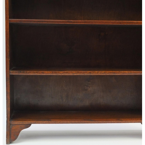 74 - Oak open bookcase fitted with five shelves, 119cm high