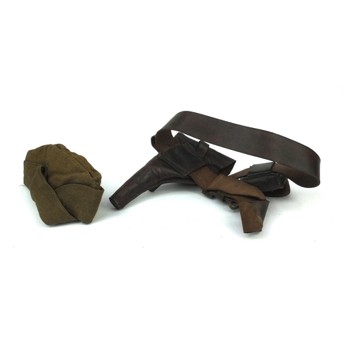 814 - Military interest leather belt and gun holster together with a canvas beret