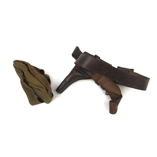 814 - Military interest leather belt and gun holster together with a canvas beret