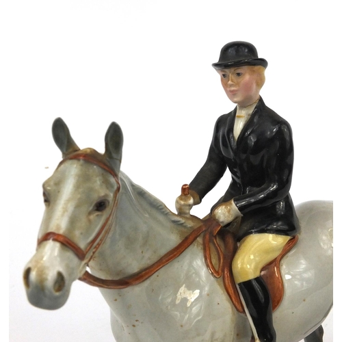 525 - Beswick dappled grey horse with huntswomen, factory marks to the base, 20cm high