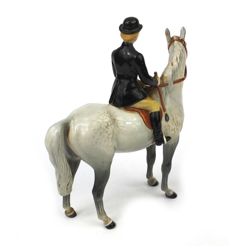 525 - Beswick dappled grey horse with huntswomen, factory marks to the base, 20cm high