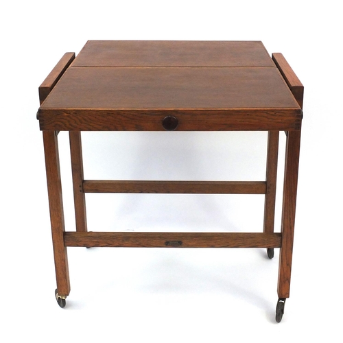 136 - Besway cantilever tea trolley with Bakelite handle and plaque, 74cm high