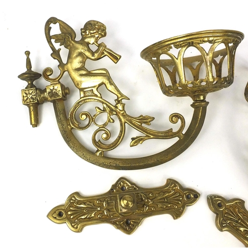 264 - Pair of brass putti wall sconces, each 32cm in length