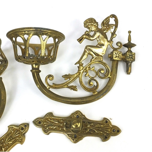 264 - Pair of brass putti wall sconces, each 32cm in length