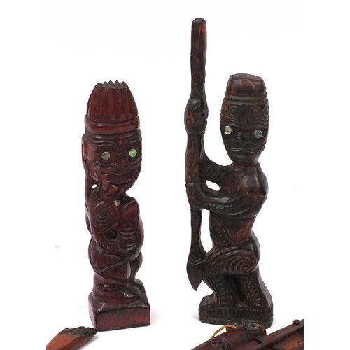 628 - Collection of New Zealand carved wooden items, the largest 47cm long