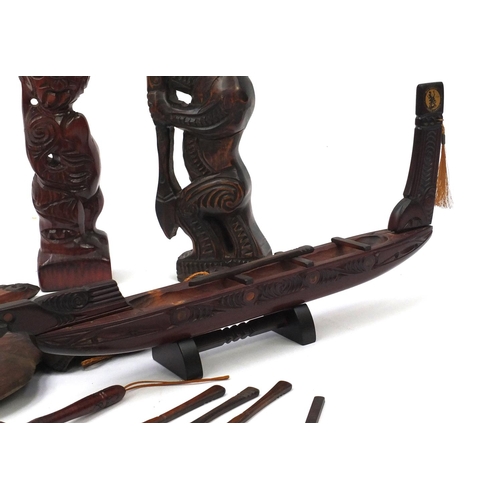 628 - Collection of New Zealand carved wooden items, the largest 47cm long