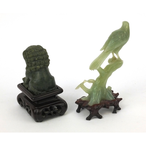 500 - Oriental carved Jadeite Foo dog and bird of paradise, both raised on hard wood bases, the larger 16c... 