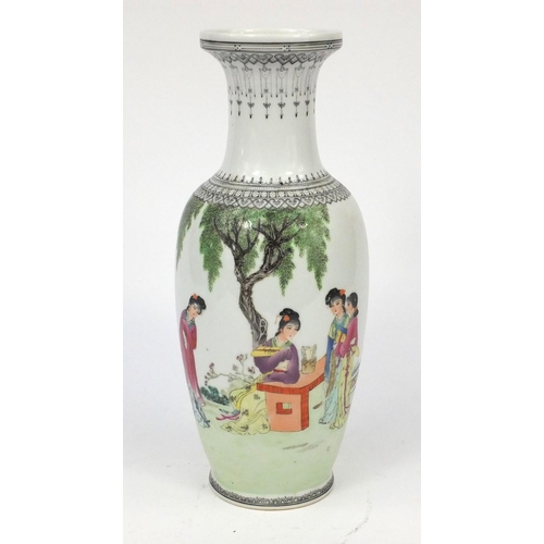 205 - Oriental porcelain baluster shaped vase decorated with females under a tree, 31cm high