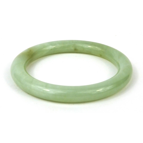 350 - Chinese green jadeite bangle, 8.5cm in diameter, approximate weight  50.6g