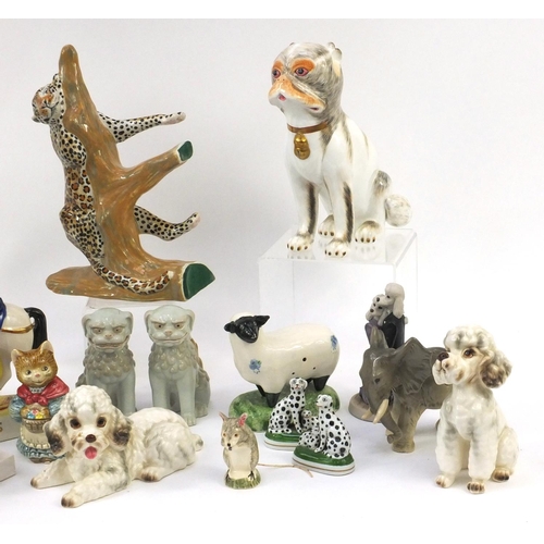 478 - Collection of china and pottery animals including a pair of Sutherland bone china seated dogs, Staff... 