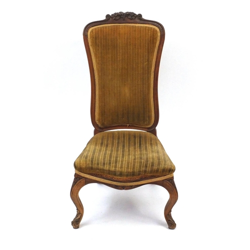 21 - Carved walnut nursing chair with gold striped upholstery, 90cm high