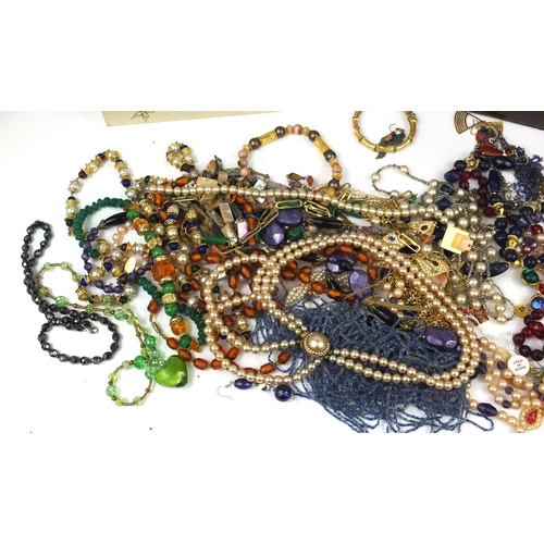 386 - Large selection of vintage and later costume jewellery, mostly necklaces and earrings, housed in a r... 