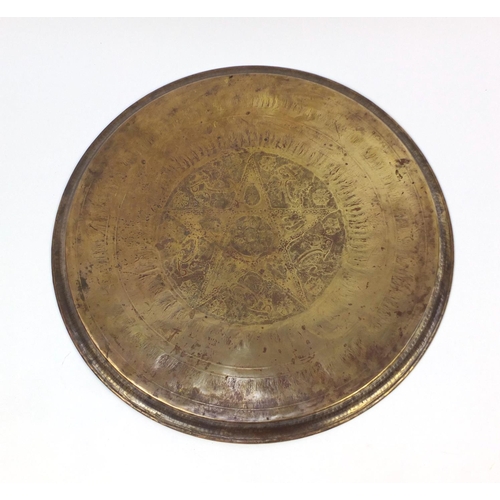 654 - Large Middle Eastern brass tray, engraved with script and floral motifs, 58cm in diameter