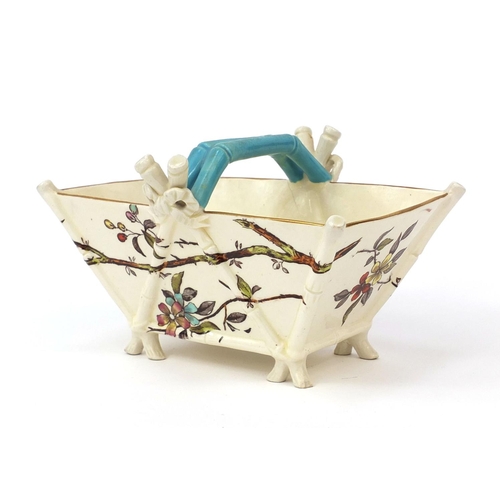 501 - Christopher Dresser style porcelain basket, 19cm long