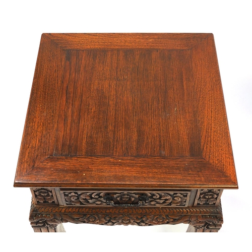 2023 - Pair of Indonesian hardwood side tables, each with a frieze drawer and carved with flowers and folia... 
