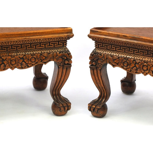 2031 - Pair of Indonesian hardwood occasional tables with galleried tops, each carved with flowers and foli... 