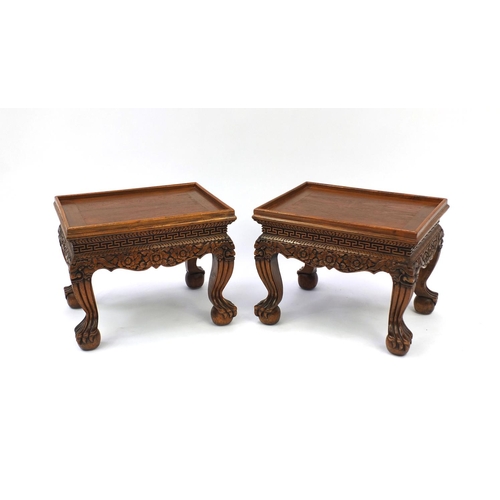 2031 - Pair of Indonesian hardwood occasional tables with galleried tops, each carved with flowers and foli... 