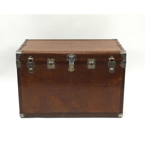 2044 - Vintage travelling trunk with part labels and Terryville USA lock, 67cm high x 97cm wide x 55cm deep