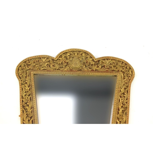 2030 - Ornate gilt wooden mirror carved with foliage, 80cm high x 62cm wide