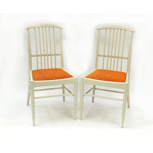 2032 - Pair of 1970's Finnish Asko stick back chairs with orange upholstered seats, each 87cm high