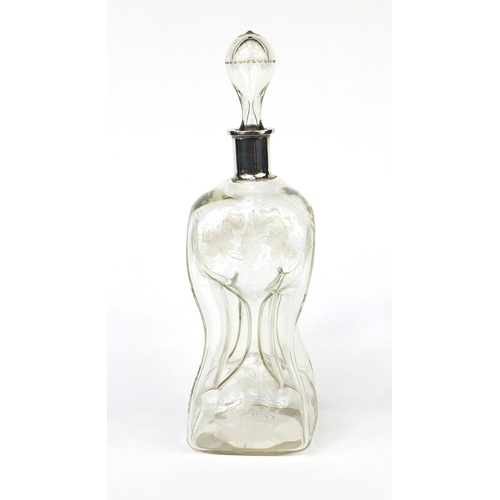 2181 - Hour glass decanter with etched leave and berry decoration, 35cm high