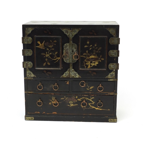 2104 - Japanese black lacquered table cabinet fitted with a pair of doors, and five drawers, 25cm high x 23... 