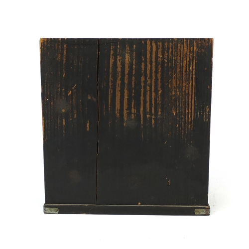 2104 - Japanese black lacquered table cabinet fitted with a pair of doors, and five drawers, 25cm high x 23... 