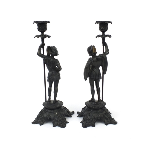 2091 - Pair of bronzed figural candlesticks with naturalistic bases, each 33cm high