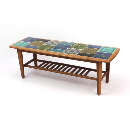 2038 - 1970's tile topped coffee table with laddered under tier, 40cm high x 115cm wide x 39cm deep