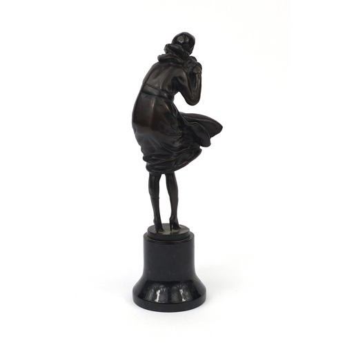 2093 - Bronze study of an Art Deco female wearing hand warmers, raised on a circular marble base, overall 3... 